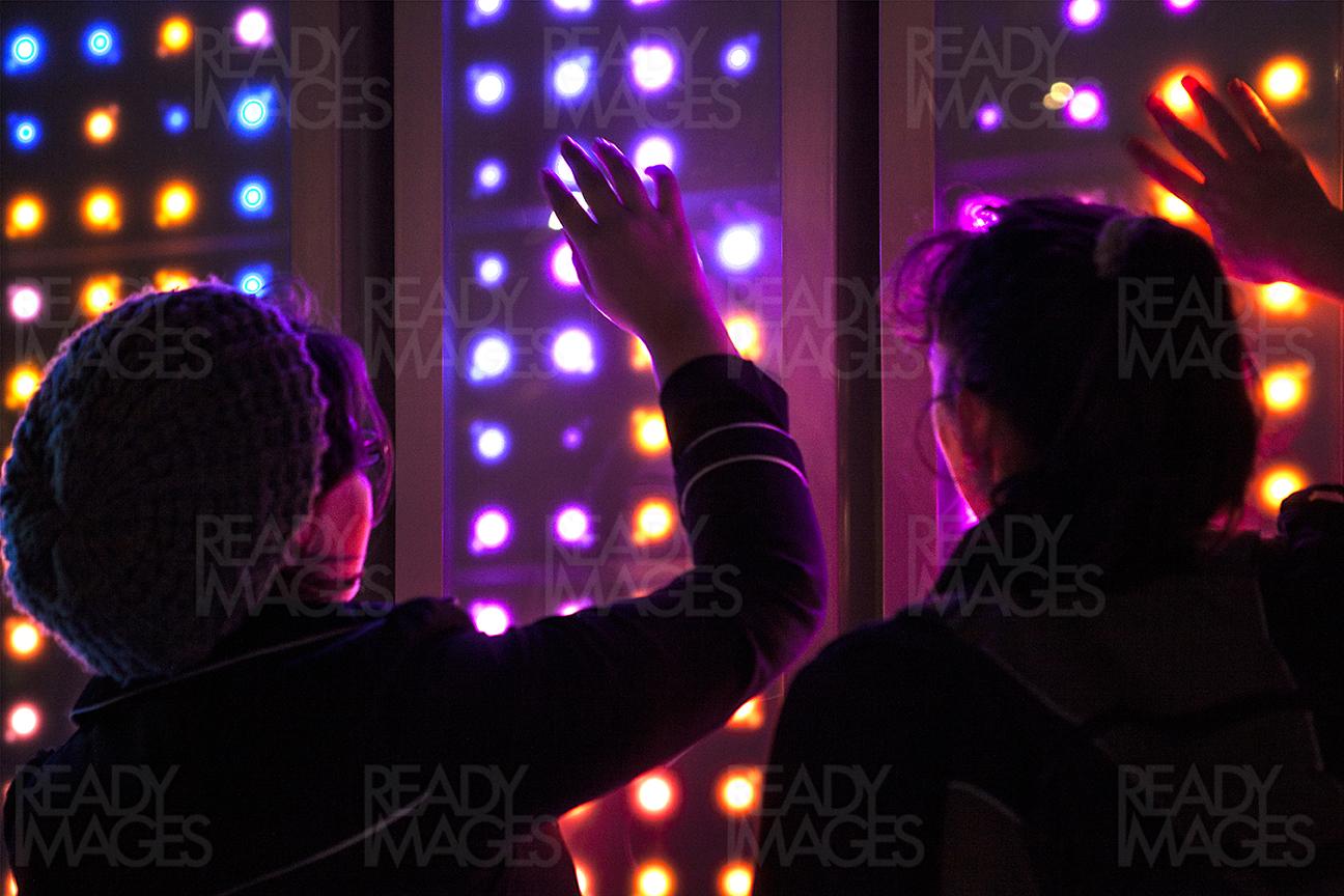 Visitors enjoying light artwork at night during Vivid Sydney Light Festival