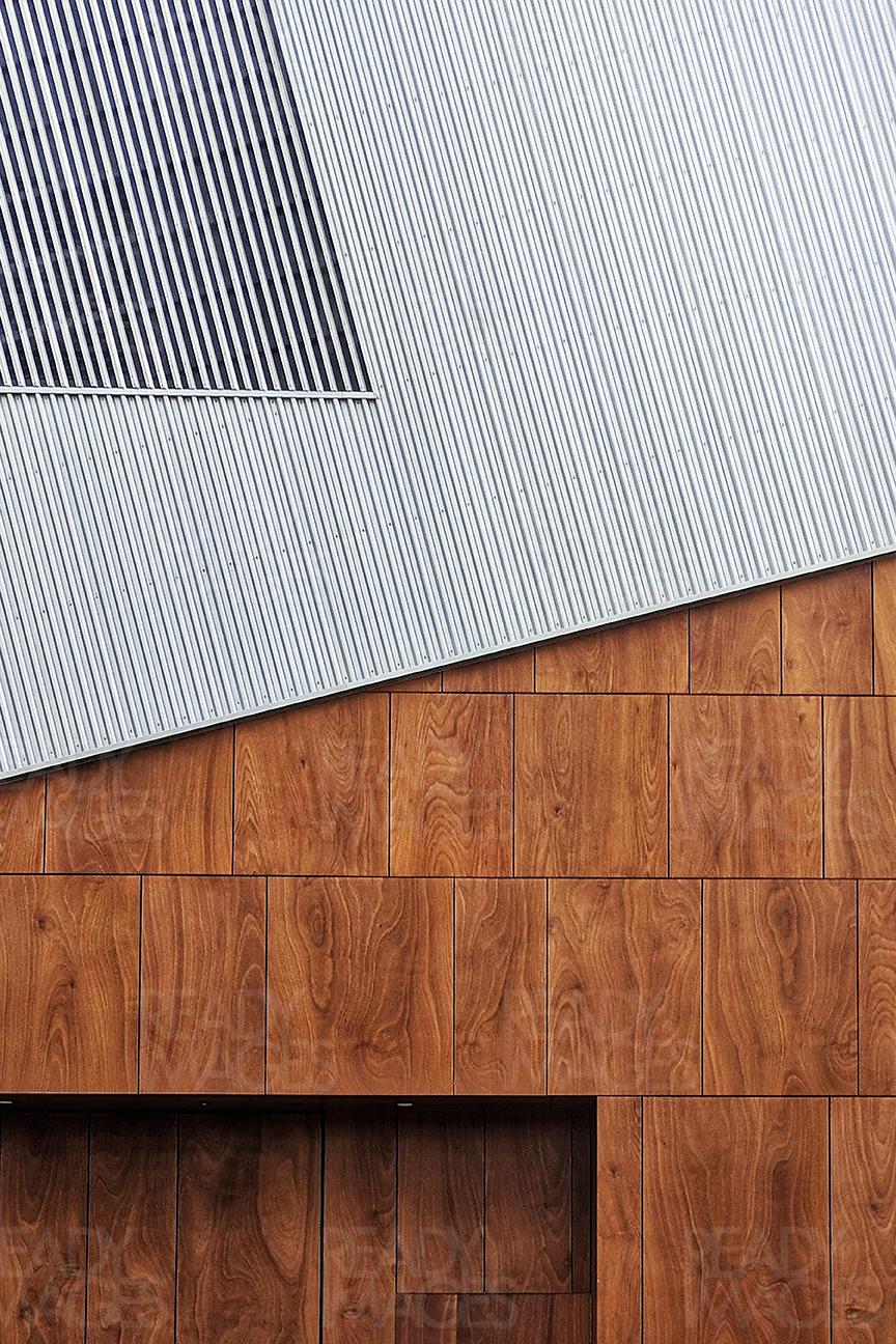 Contemporary minimal architecture image - corrugated sheets and timber detail facade