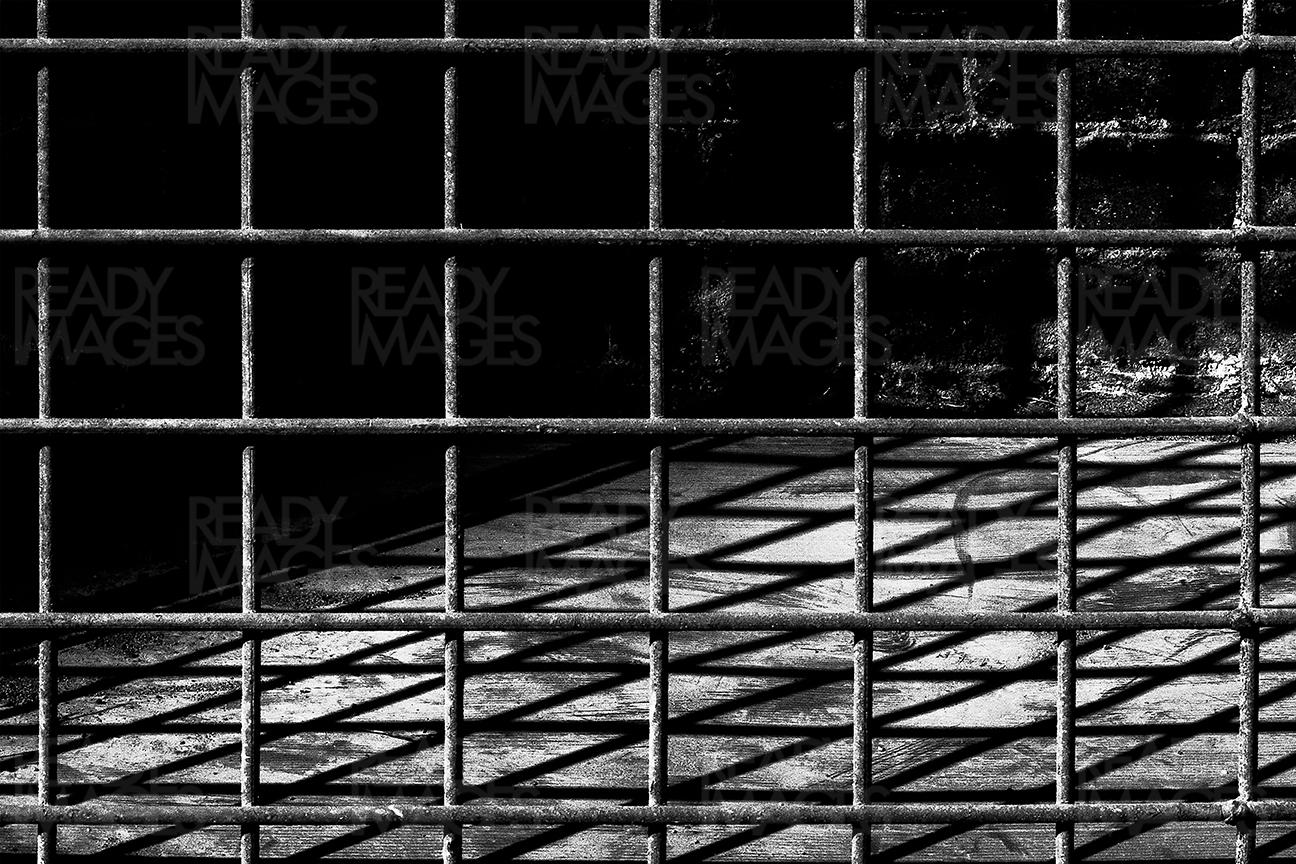 Black and white image of an old wire mesh and its shadow found at Cockatoo Island