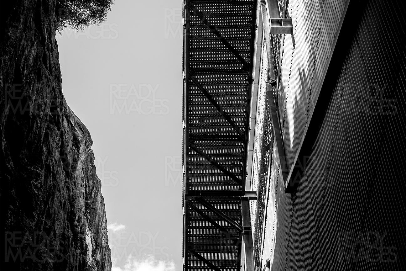 Black and white image, looking up at the footbridge attached to the Industrial Precinct, Cockatoo Island