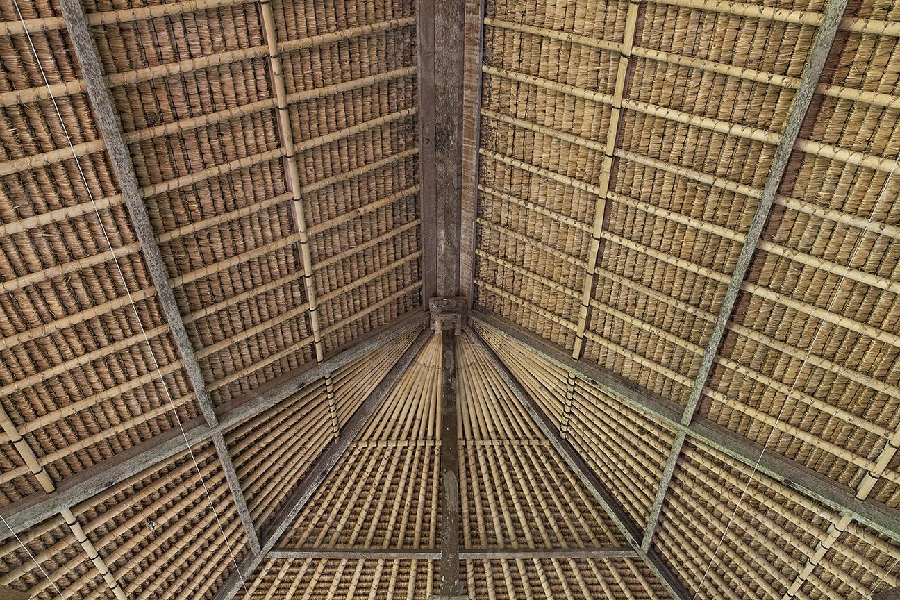 View from down, looking at the traditional Balinese roof detail built almost entirely of organic and local materials