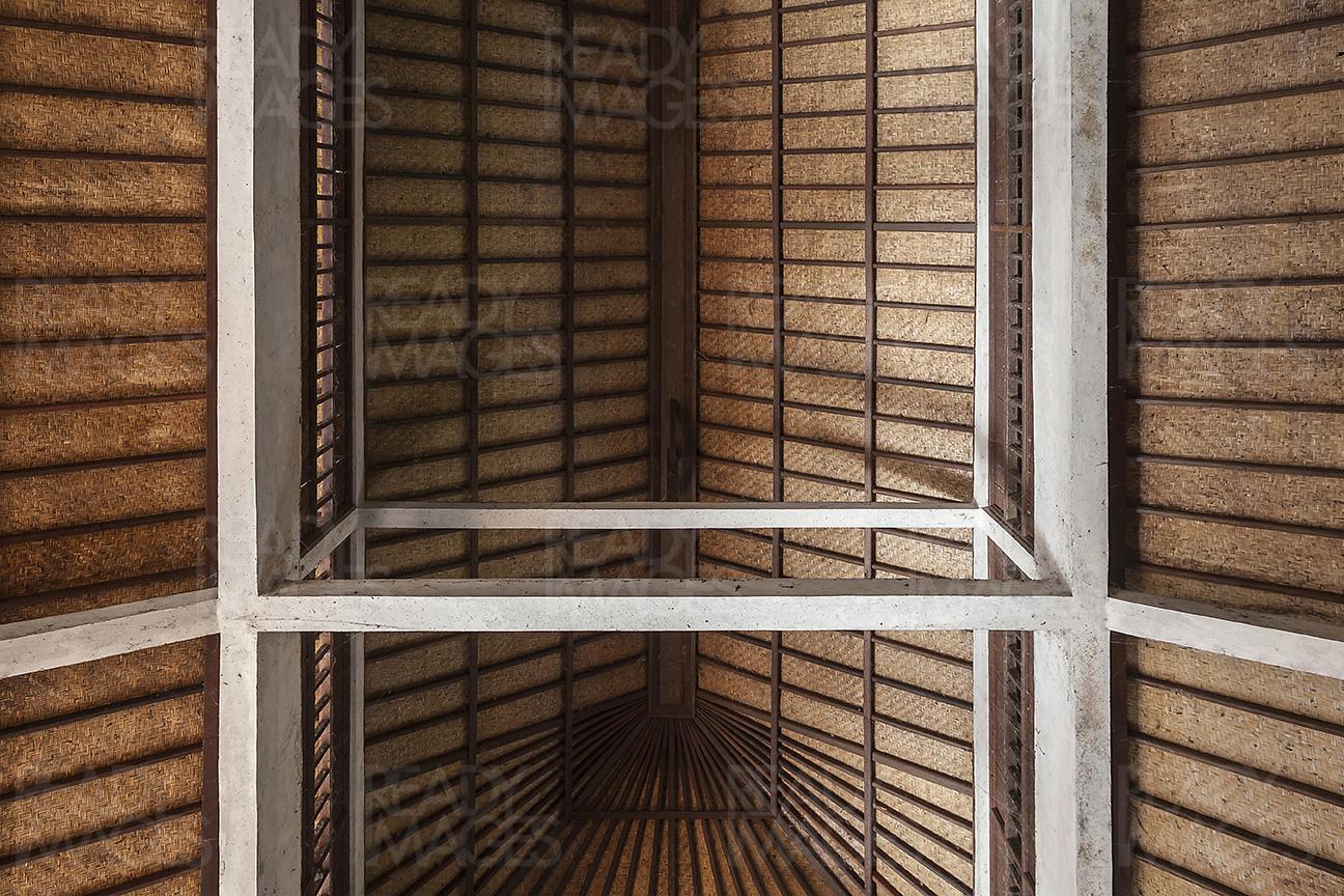 View from down, looking up at the traditional Balinese roof detail built almost entirely of organic and local materials