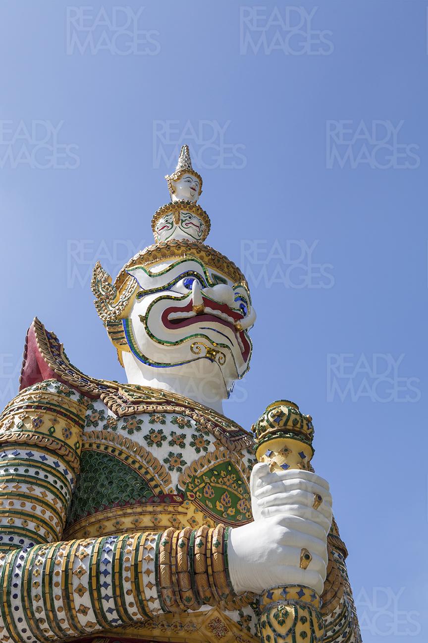 Statue at Wat Phra Kaew, the Emerald Buddha Temple in Bangkok, Thailand