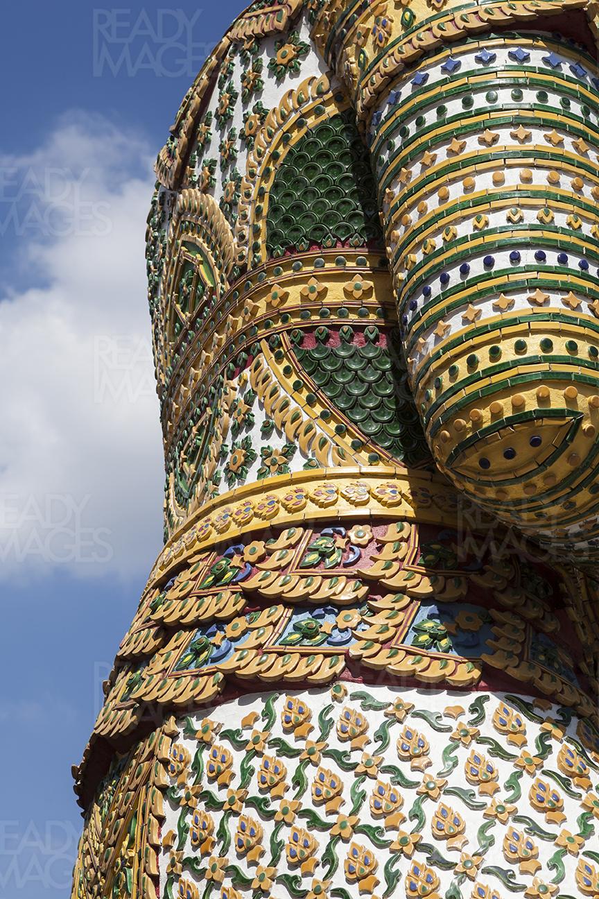 Detail of a statue at the entrance of Wat Phra Kaew, the Emerald Buddha Temple in Bangkok, Thailand
