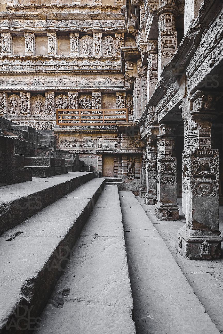 Image showing steps, ornamental structural details and the intricate craving/sculptures on the walls of the Rani Ki Vav (Stepwell)