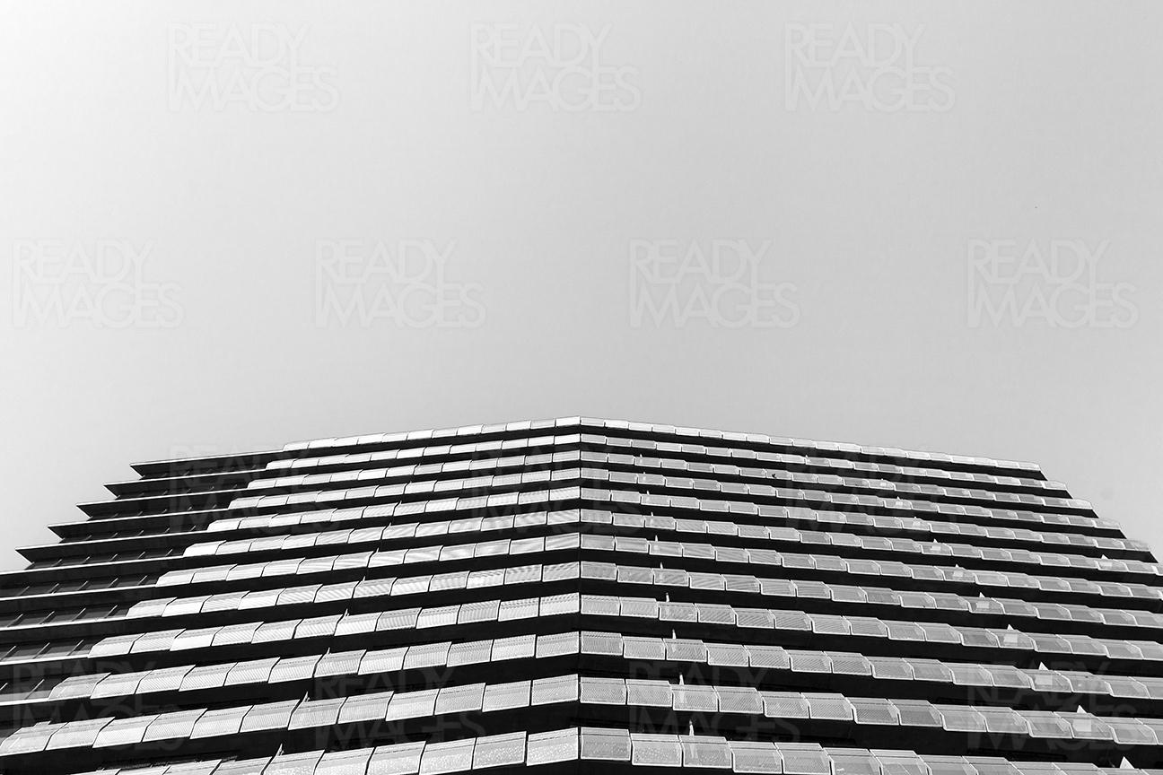 Fine art black and white low angle image, looking up at the tall building in Melbourne