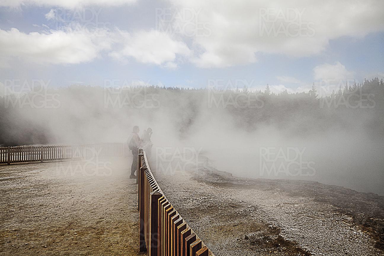 Tourists looking at the geothermal lake of Wai-O-Tapu in Rotorua