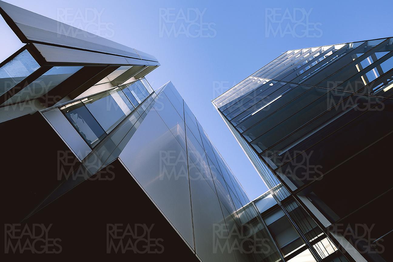 Abstract Modern Architecture Image - view from down, looking up at the solid and glazed facade of a skyscraper in Sydney