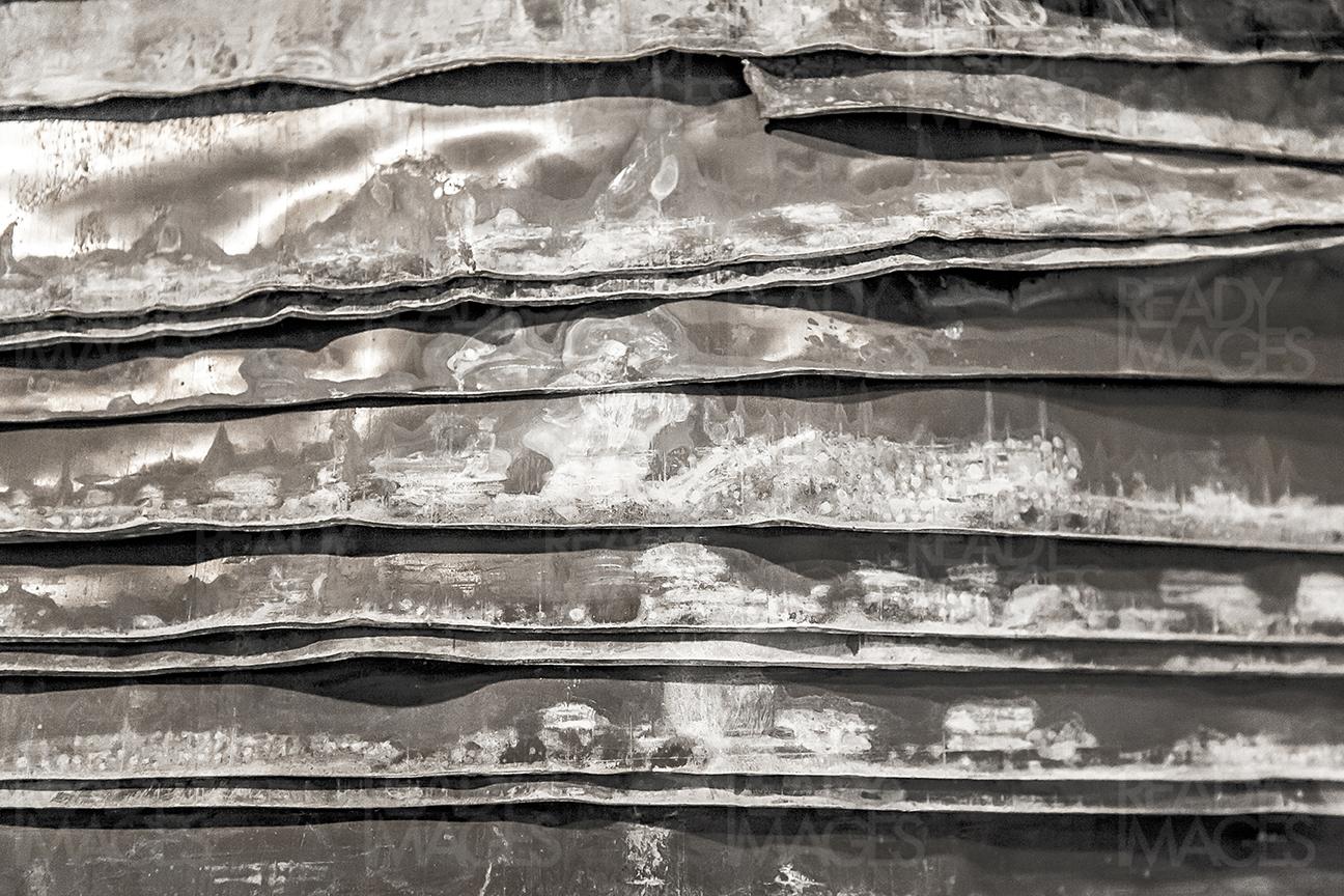 Abstract image of the rustic damaged corrugated metal sheets
