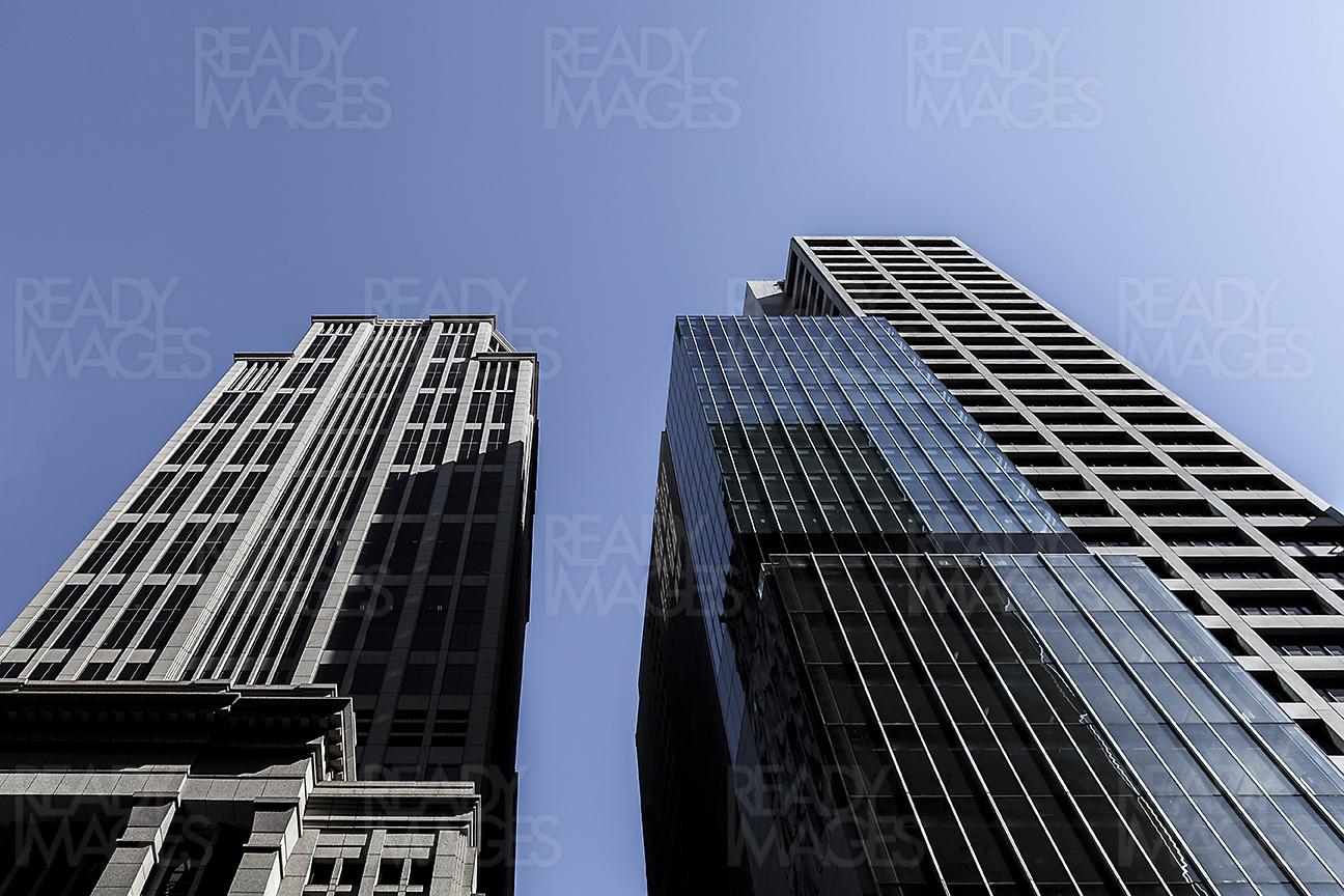 Low angle image, looking up at the tall buildings in Melbourne. Image taken on a clear blue sky
