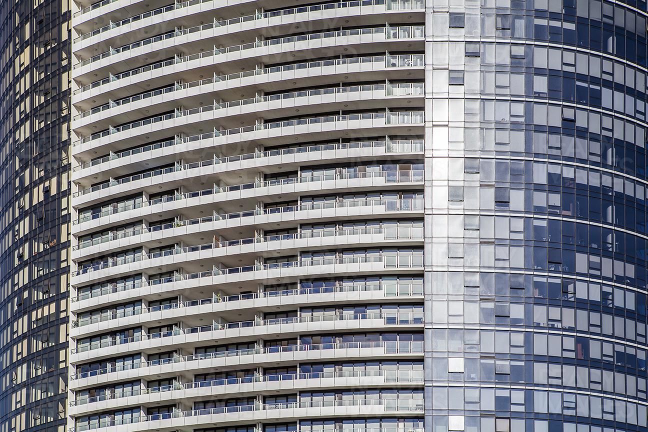 Front Elevation of a tall tower in Melbourne, Australia showing the combination of curtain wall and balconies with glass balustrade
