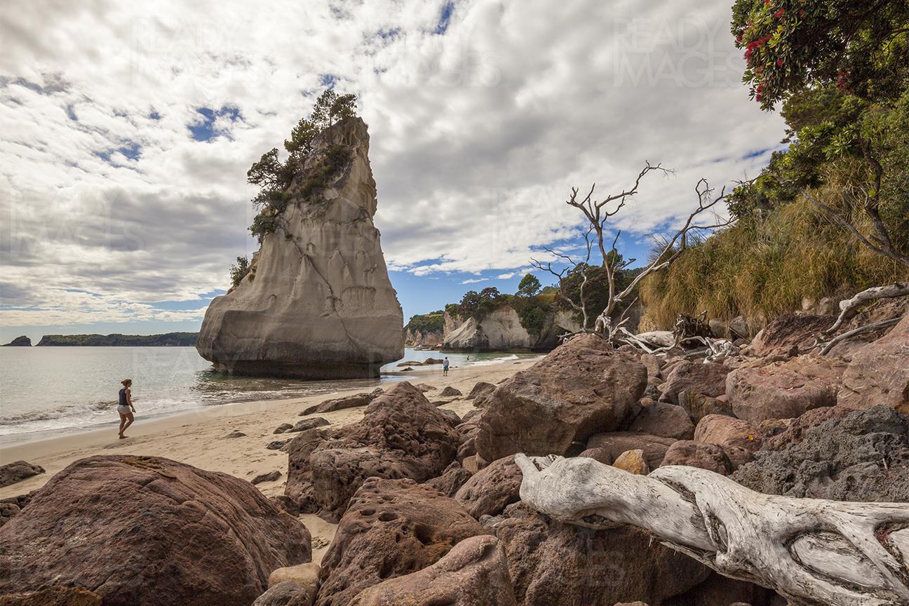 Clouds, rocks and the beach at the Cathedral Cove in the Coromandel, New Zealand