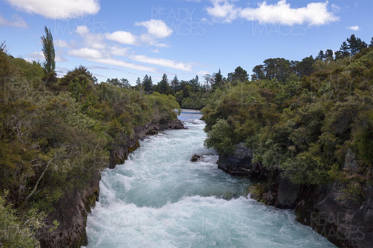 Water flowing in Waikato River near Huka Falls, Taupo, New Zealand